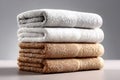 A neatly arranged stack of folded towels placed against an isolated white background Royalty Free Stock Photo