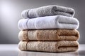 A neatly arranged stack of folded towels placed against an isolated white background Royalty Free Stock Photo