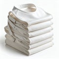 Neatly arranged stack of pristine baby bibs, showcasing simplicity on white background Royalty Free Stock Photo
