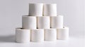 Stacked White Rolls of Toilet Paper on a Light Background Royalty Free Stock Photo
