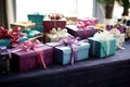 a neatly arranged table with gift boxes with ribbons