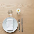 To the right of the plate a fork and knife are placed parallel Royalty Free Stock Photo