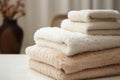 Neatly arranged white towels on bed in bedroom with ample free space around, wide angle view Royalty Free Stock Photo