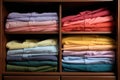neatly folded colorful shirts in a closet Royalty Free Stock Photo