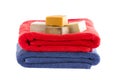 Neatly folded cotton towels with soap