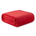 Neatly Folded Red Fleece Blanket on a White Background soft cozy Royalty Free Stock Photo