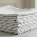 Neatly folded stack of gray linen sheets. Each sheet displays a subtle texture Royalty Free Stock Photo