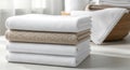 Neatly folded stack of light-colored towels on a wooden surface Royalty Free Stock Photo