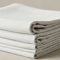 A neatly folded stack of light gray linens. The texture is smooth and slightly textured, Royalty Free Stock Photo