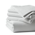 A neatly folded stack of white bed sheets is displayed, likely made from cotton or a cotton blend Royalty Free Stock Photo