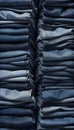 Neatly Folded and Stacked Blue Jeans Display, Showcasing Various Shades and Textures of Denim, Generative AI