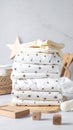 Neatly Folded White and Beige Cloth Stack with Wooden Decor on Gray Surface Royalty Free Stock Photo