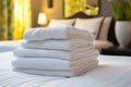 Neatly folded white towel on a luxurious hotel resort bed