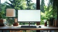 Neatly organized desk space in front of large window with wooden desk and computer setup with large monitor displaying Royalty Free Stock Photo