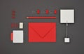 Neatly organized red stationery flat lay on grey