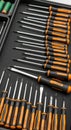 A neatly organized set of screwdrivers is displayed in a foam-lined case. The tools Royalty Free Stock Photo