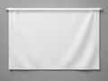 A neatly rolled-up white roller blind against a plain background isolated on white background Royalty Free Stock Photo