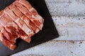 Neatly sliced uncooked fresh raw pork on cutting board Royalty Free Stock Photo