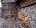 Neatly stacked chopped wood against the wall of the house Royalty Free Stock Photo