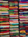 Neatly stacked colorful designer silk saris in racks in a textile shop. Incredible India