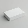 A neatly stacked pile of blank white paper rests on a smooth gray surface. The stack is Royalty Free Stock Photo