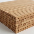 A neatly stacked pile of rectangular wooden dowels, each with a smooth surface and Royalty Free Stock Photo