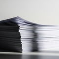 A neatly stacked pile of A4-sized white sheets of paper, viewed from a low angle. The stack\'s edges Royalty Free Stock Photo