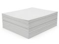 A neatly stacked pile of unused white printer paper against a plain white background Royalty Free Stock Photo