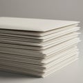 A neatly stacked pile of white envelopes sits on a smooth surface. Each envelope is Royalty Free Stock Photo