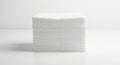 A neatly stacked pile of white paper napkins or tissues is shown against a plain white Royalty Free Stock Photo