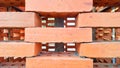 Neatly stacked red bricks with visible gaps, creating a geometric pattern Royalty Free Stock Photo