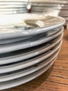 Stack of Clean White Plates on Wooden Tabletop Royalty Free Stock Photo