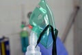 A nebulizer or nebuliser mask that is connected to oxygen cylinder or a drug delivery device used to administer medication in the