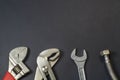 Necessary set of tools for plumbers on a black background Royalty Free Stock Photo