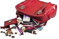 Necessary things in red woman handbag Royalty Free Stock Photo