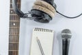 Neck guitar notebook in top view with music concept whitebackgr Royalty Free Stock Photo