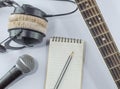 Neck guitar notebook in top view with music concept whitebackground Royalty Free Stock Photo