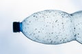 The neck of a plastic bottle with water drops inside, macro shot. Royalty Free Stock Photo