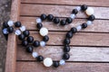 Necklace of black and moonstone beads Royalty Free Stock Photo