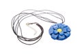 Necklace with blue flower pendant of polymer clay isolated on white background. Female accessories, decorative ornaments