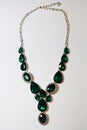 Necklace green stones decoration on a white background