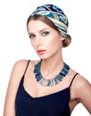 Necklace and headscarf. Beauty portrait of young beautiful woman Royalty Free Stock Photo