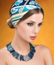 Necklace and headscarf. Beauty portrait of young beautiful woman Royalty Free Stock Photo