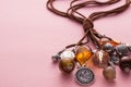 Necklace Made with Brown Leather and Silver Charms