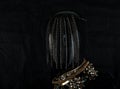 Jewelry. A hand-made necklace on a mannequin. Portrait. Dark background Royalty Free Stock Photo