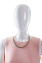 Necklace on mannequin's neck.