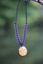 necklace on natural background with ayahuasca root decoration Royalty Free Stock Photo