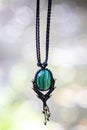 Necklace on natural background with green malachite stone Royalty Free Stock Photo