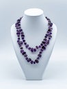Necklace with purple amethyst gemstones.