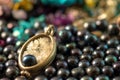 Necklace on top of a stack of black pearls